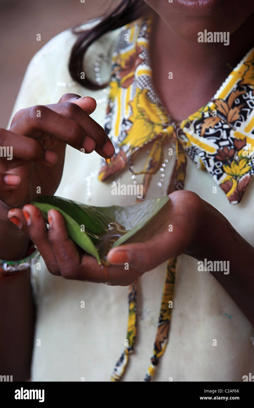 Indian girl eating honey Andhra Pradesh South India Stock Photo - Alamy