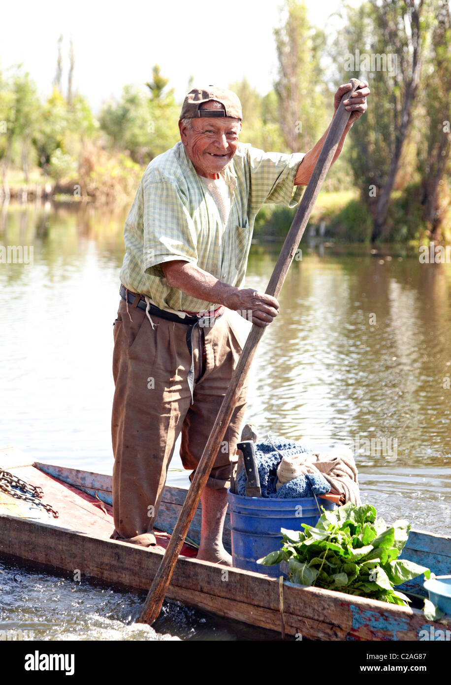 old-mexican-man-punting-boat-oaxaca-mexico-C2AG87.jpg