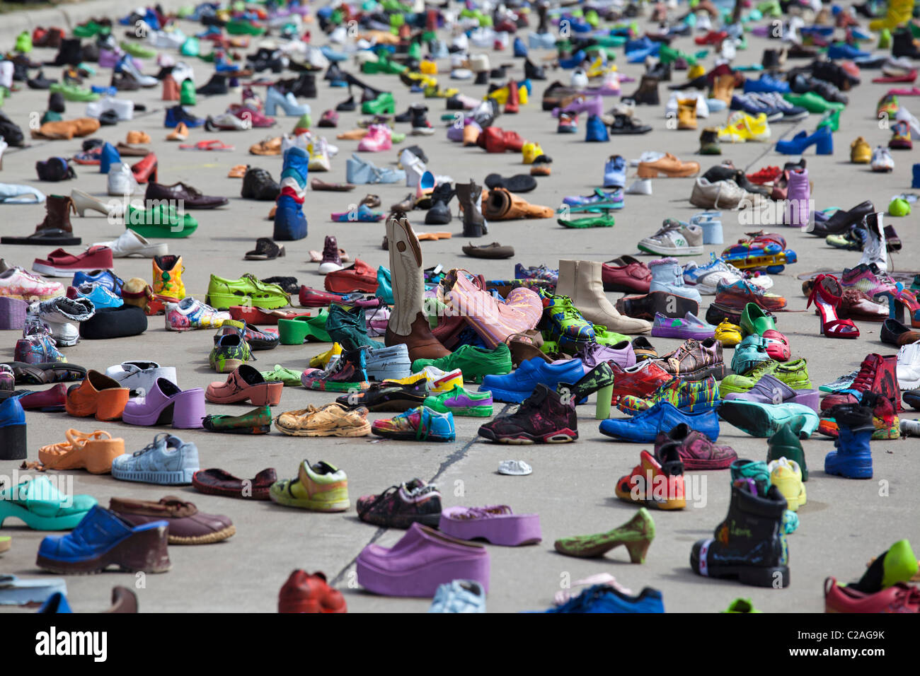 Art exhibit of thousands of shoes on the street represents the issue of