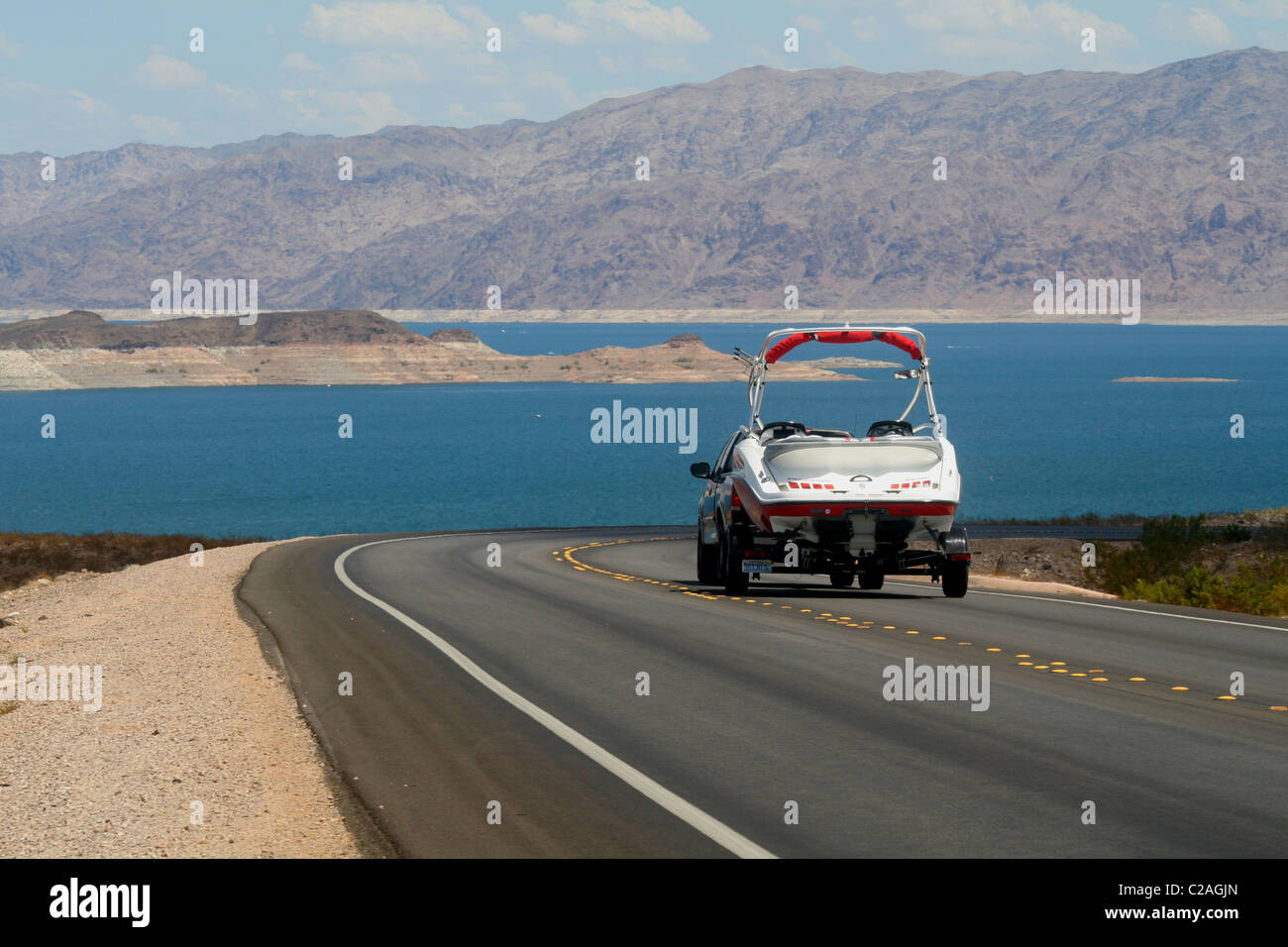 Pickup towing boat trailer on highway at Lake Mead National Recreation near Las Vegas Area Nevada Stock Photo