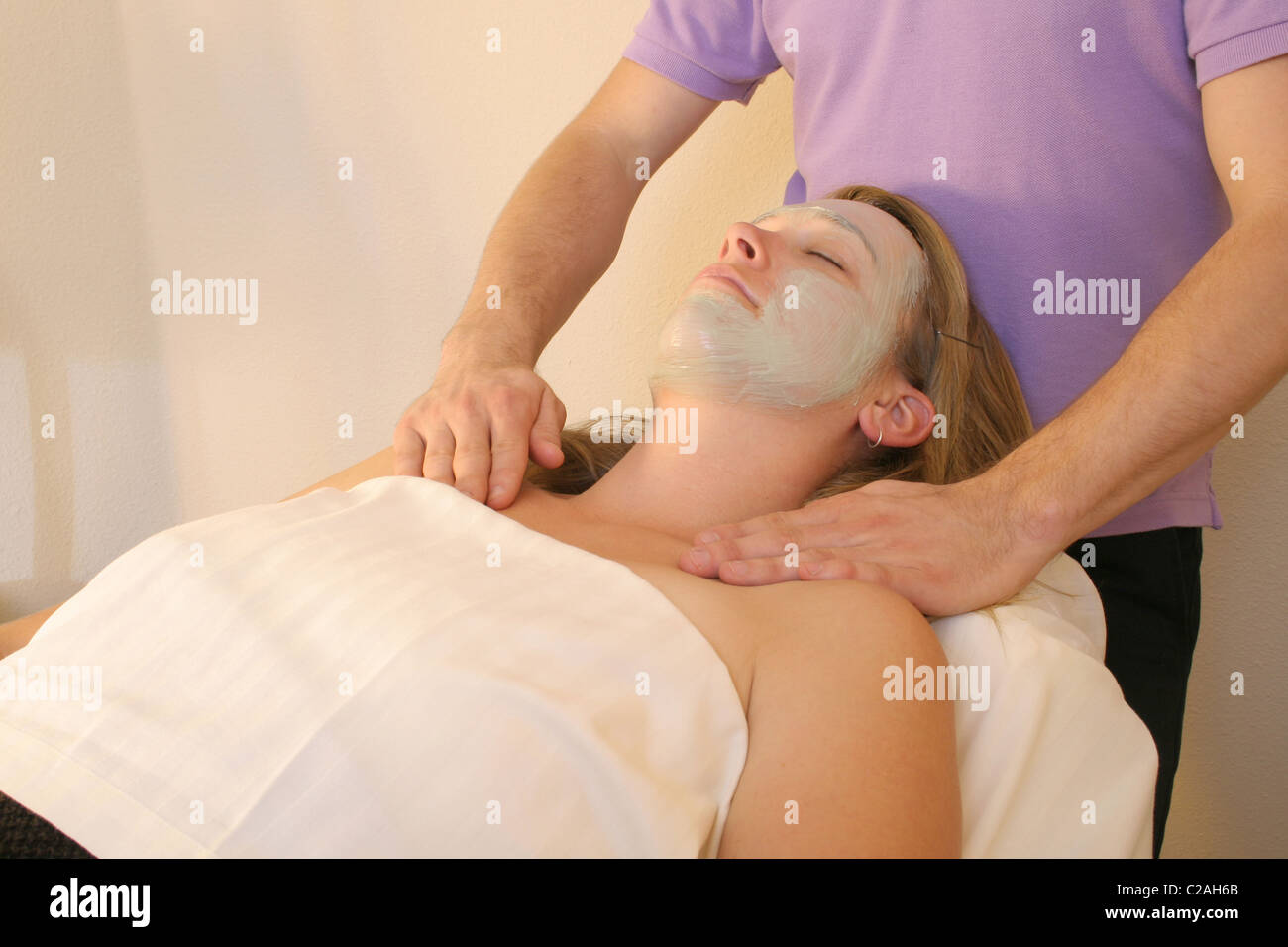 Released health spa woman receives organic facial Stock Photo