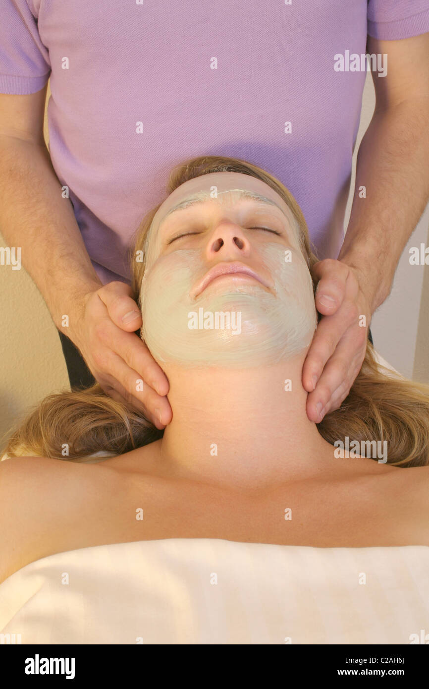 Released health spa woman receives organic facial Stock Photo