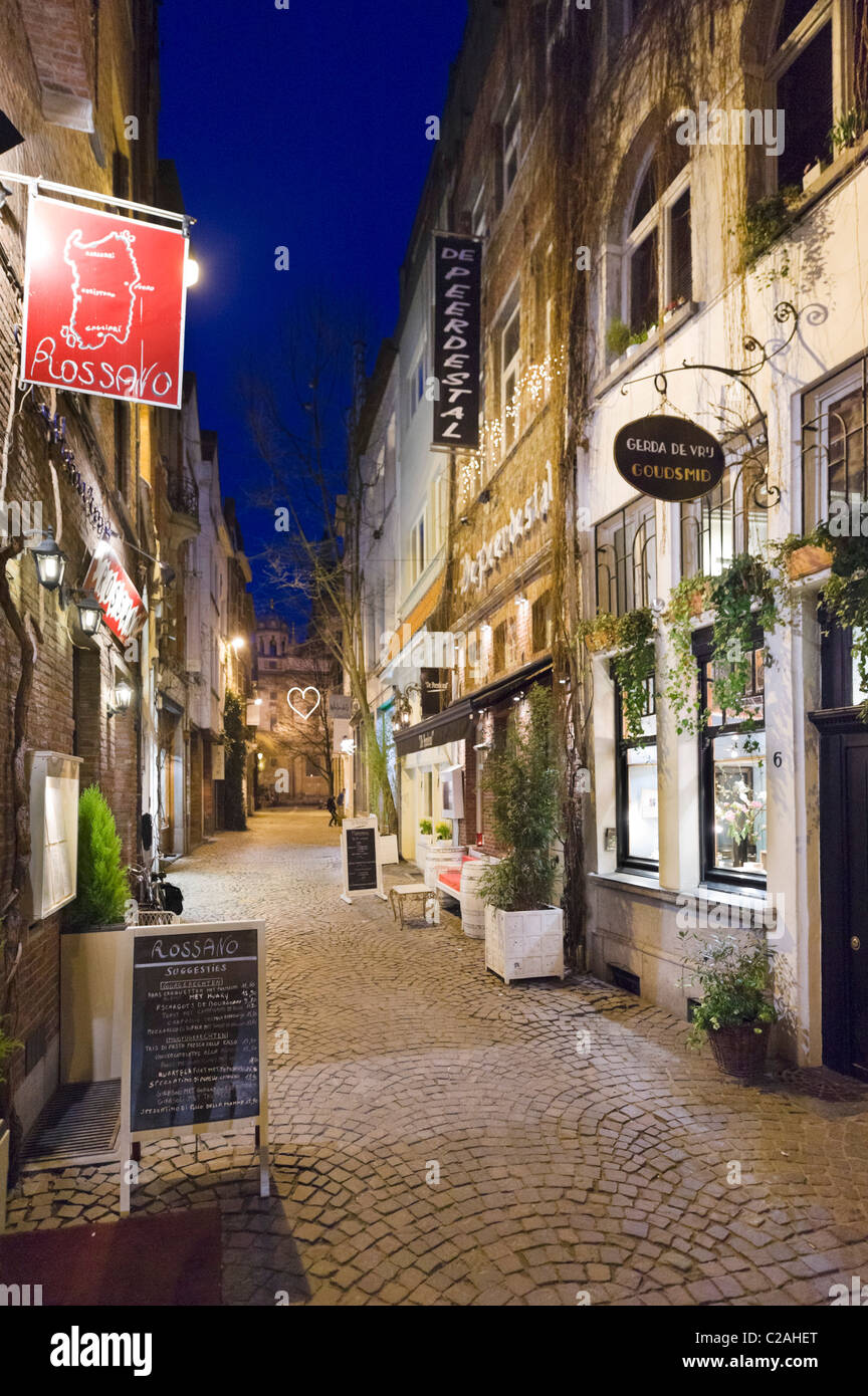 Restaurants at night on Wijngaardstraat in the old city, Antwerp, Belgium Stock Photo