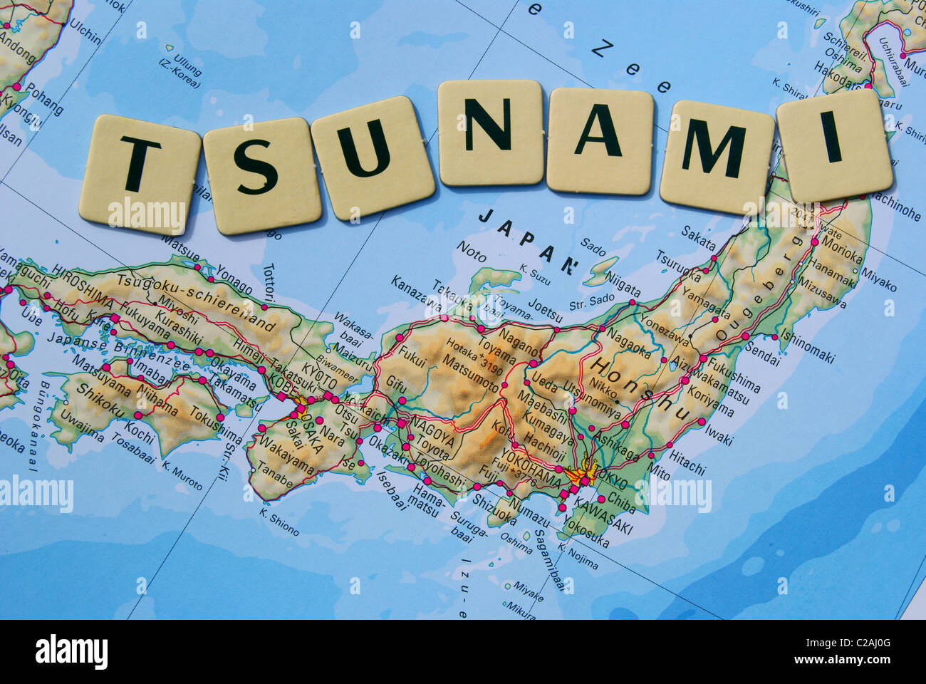tsunami spelled on a map of Japan Stock Photo Alamy