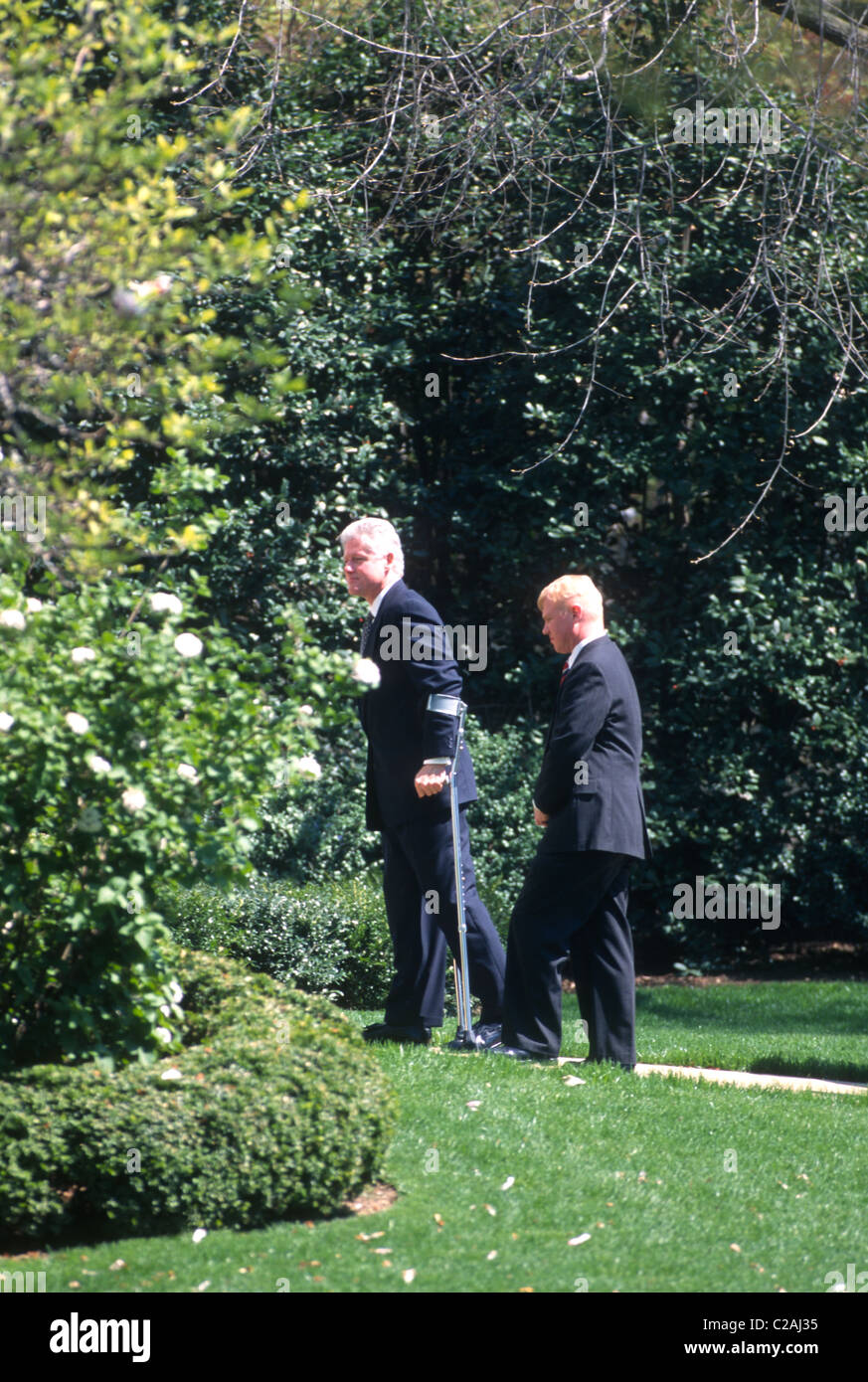 President Bill Clinton on crutches walking through the Rose Garden in Washington, DC. April 4