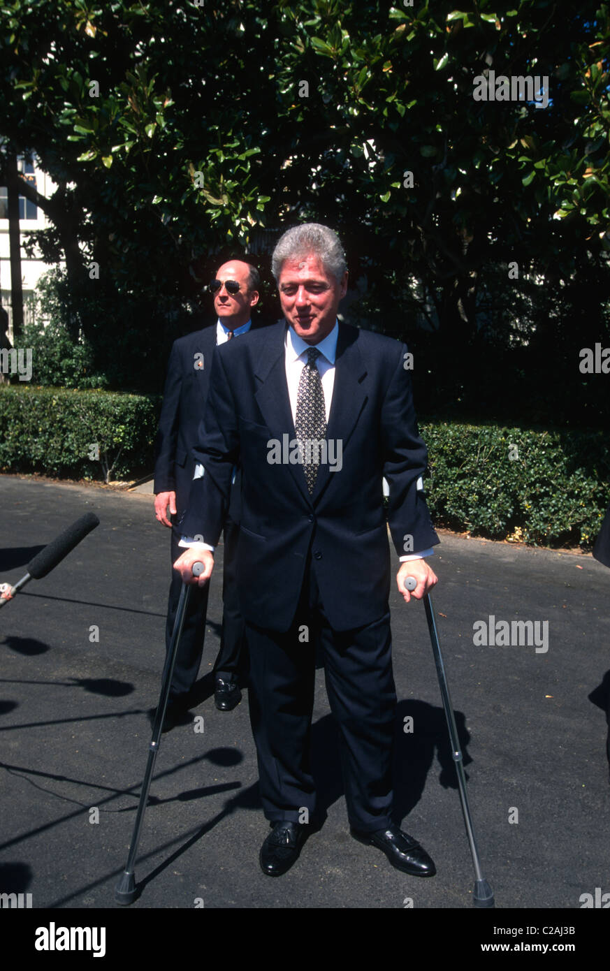President Bill Clinton on crutches walking through the Rose Garden in Washington, DC. April 4