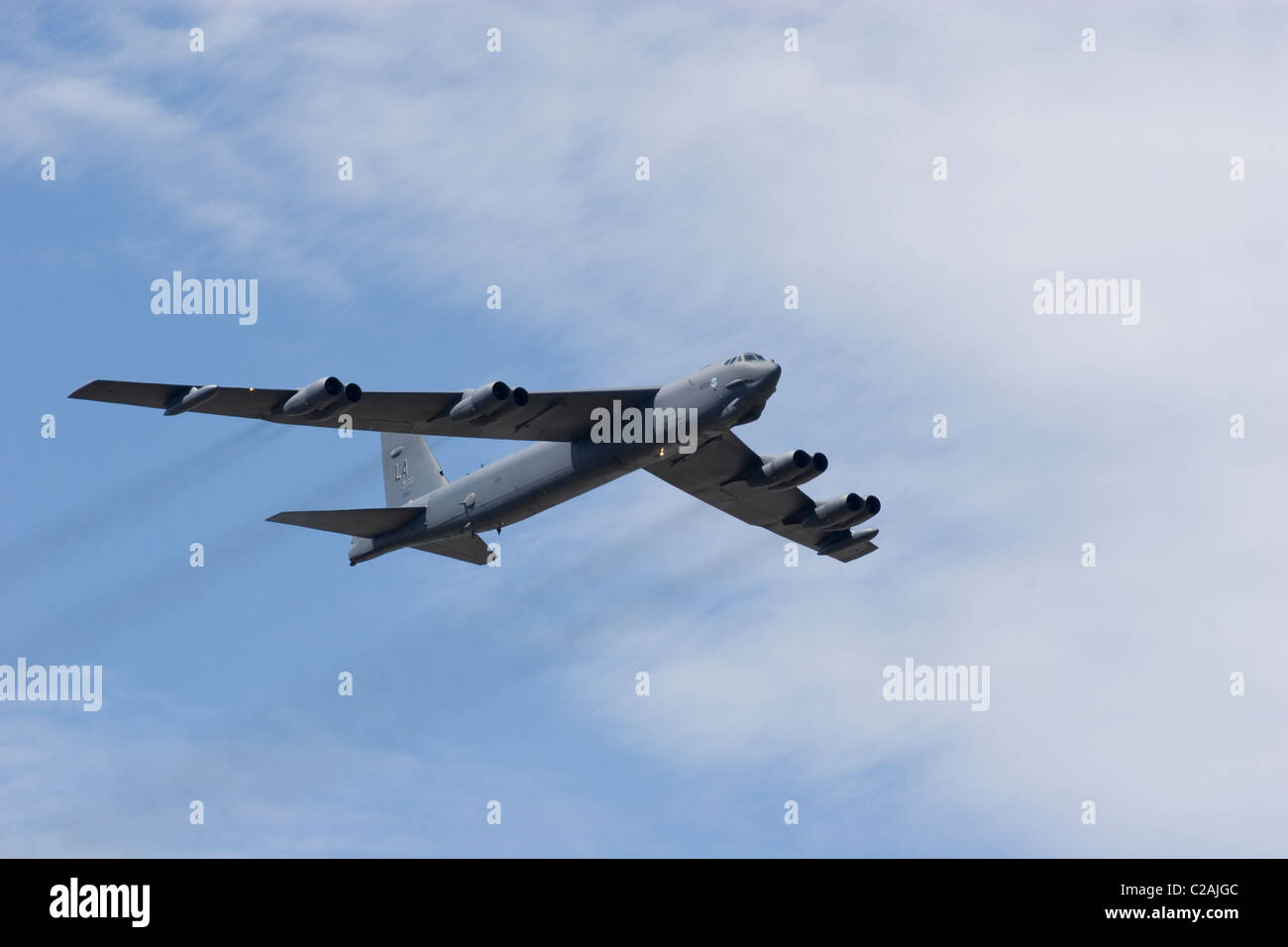 B 52 Bomber big aircraft plane military USAF command raid squadron sky air cloud sun wings engine fuselage thrust payload Stock Photo