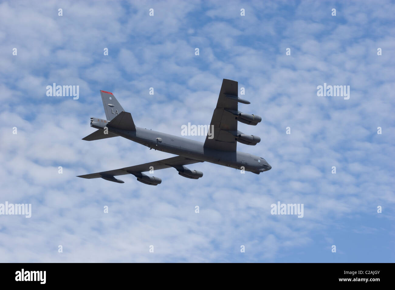 B 52 Bomber big aircraft plane military USAF command raid squadron sky air cloud sun wings engine fuselage thrust payload Stock Photo