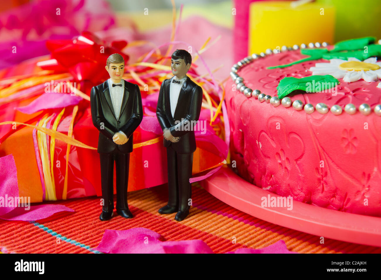 Wedding gay couple in front of a cake in pink still life Stock Photo