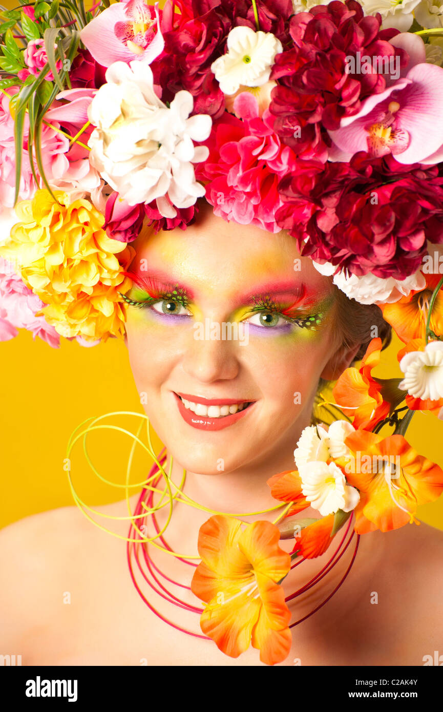Flower Girl. Beautiful young girl wearing flower wreath. Creative