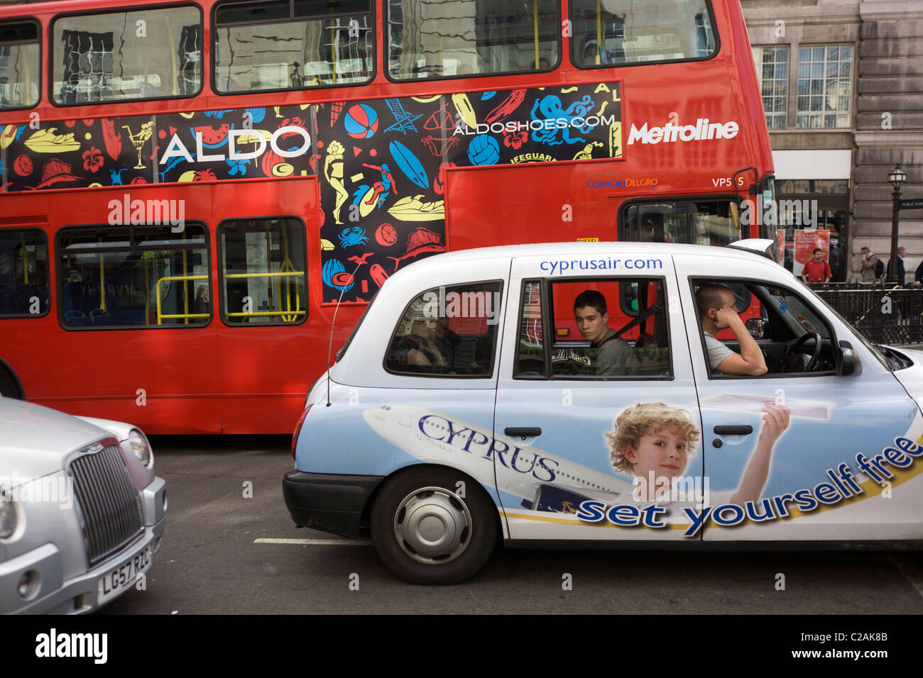 Passengers endure standstill traffic in a taxi sponsored by Cyprus