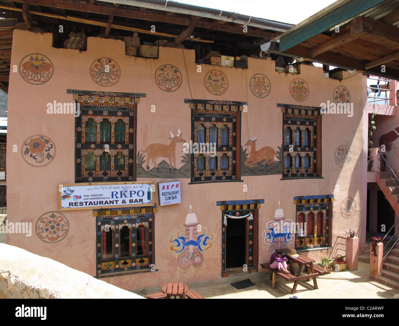 Paintings on the wall (including phallus symbols) of farmers house in Lobesa, Bhutan Stock Photo