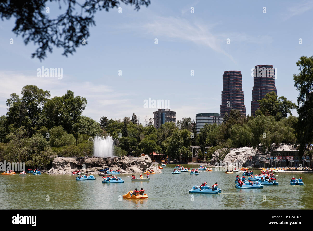 Mexico, Mexico City, tourists boating on lake in Bosque de Chapultepec (Chapultepec Park) Stock Photo