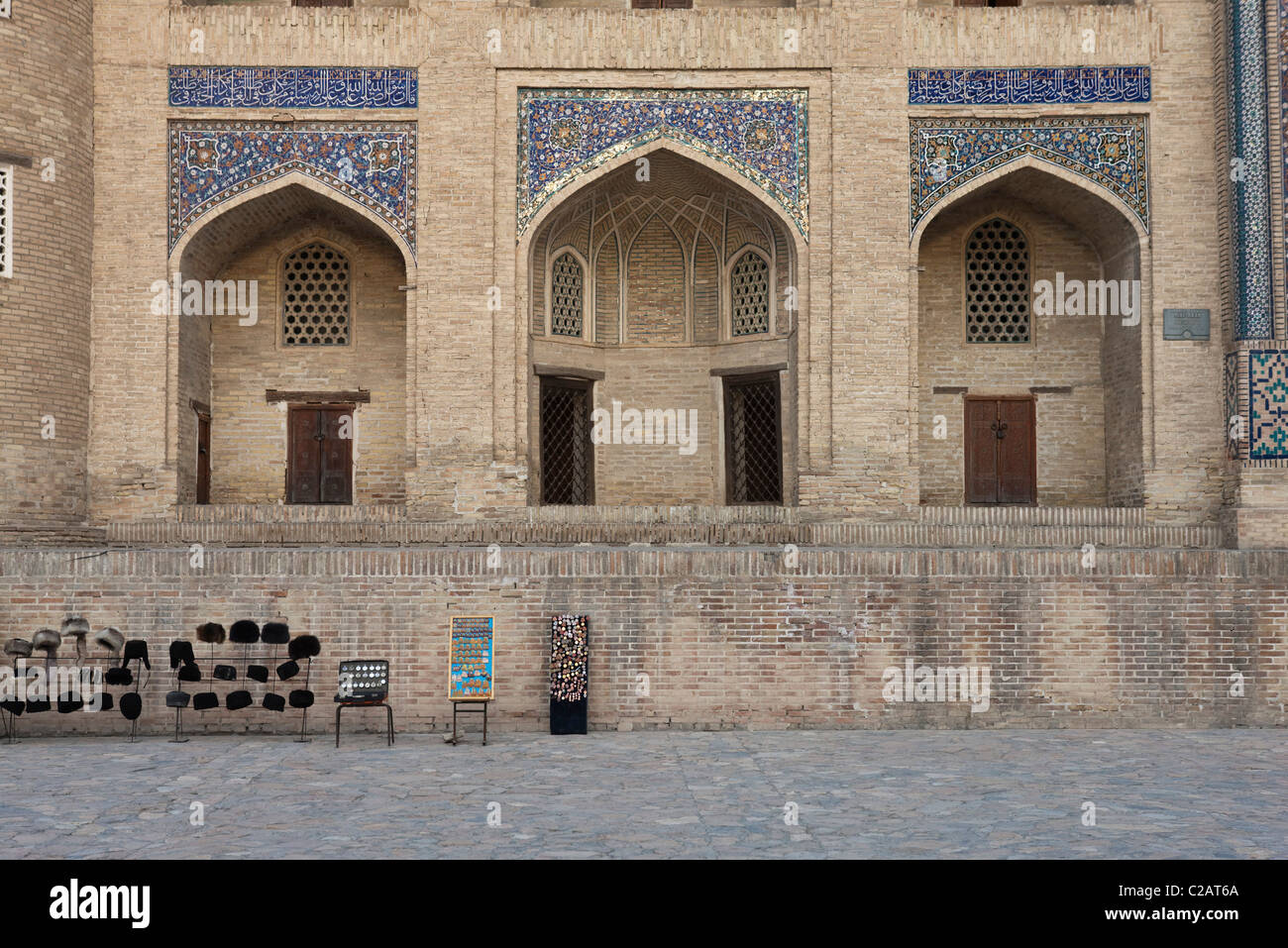 Uzbekistan, Bukhara, Mir-i Arab Madrasah, stalls selling souvenirs in front Stock Photo
