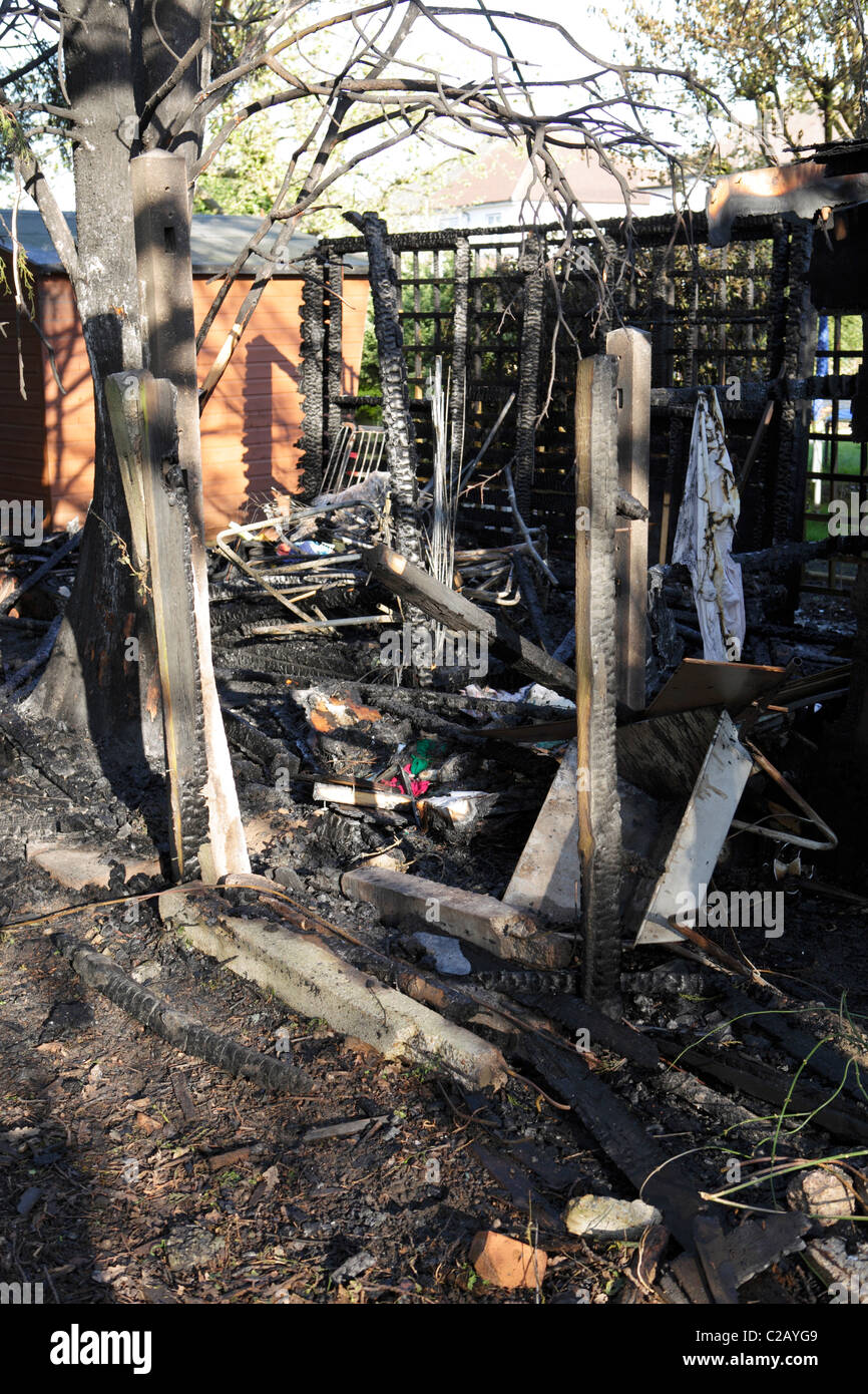 Suburban shed destroyed by fire Stock Photo