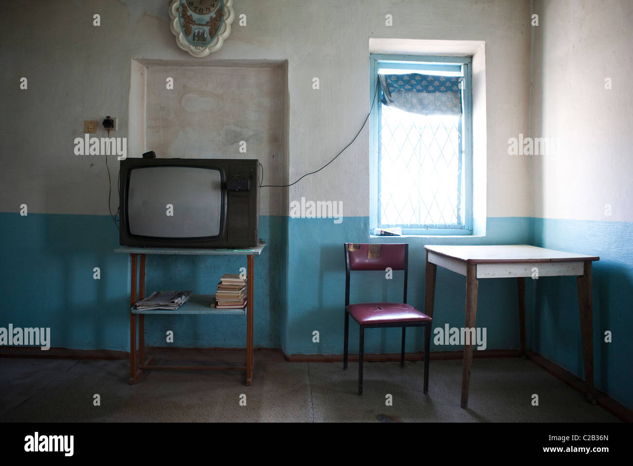 Old-fashioned television in empty room Stock Photo
