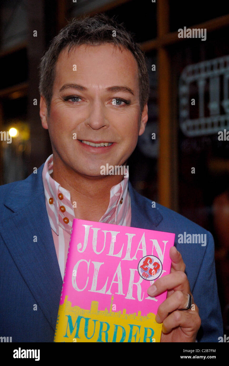 Comedian Julian Clary signs his debut novel 'Murder Most Fab' at