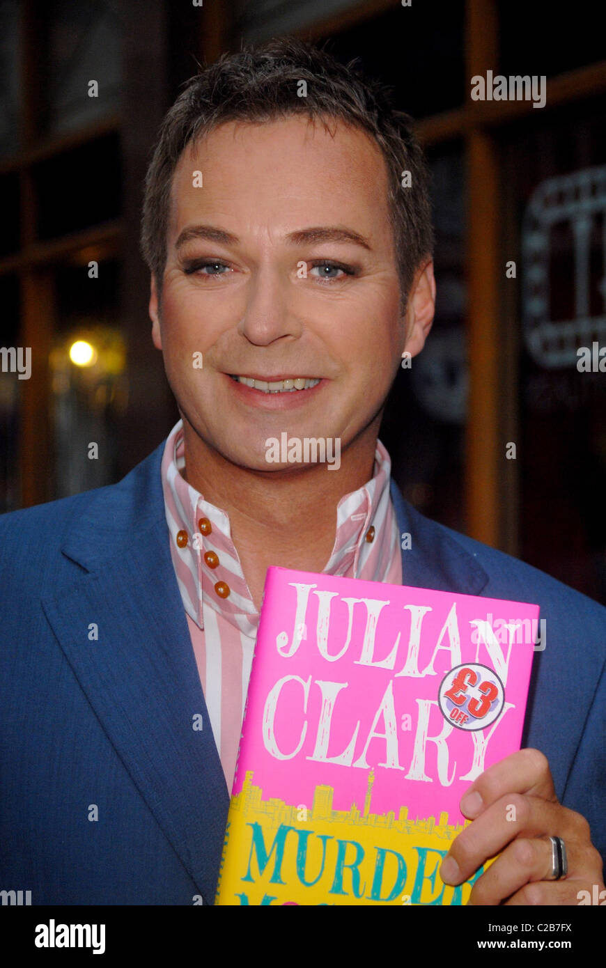 Comedian Julian Clary signs his debut novel 'Murder Most Fab' at