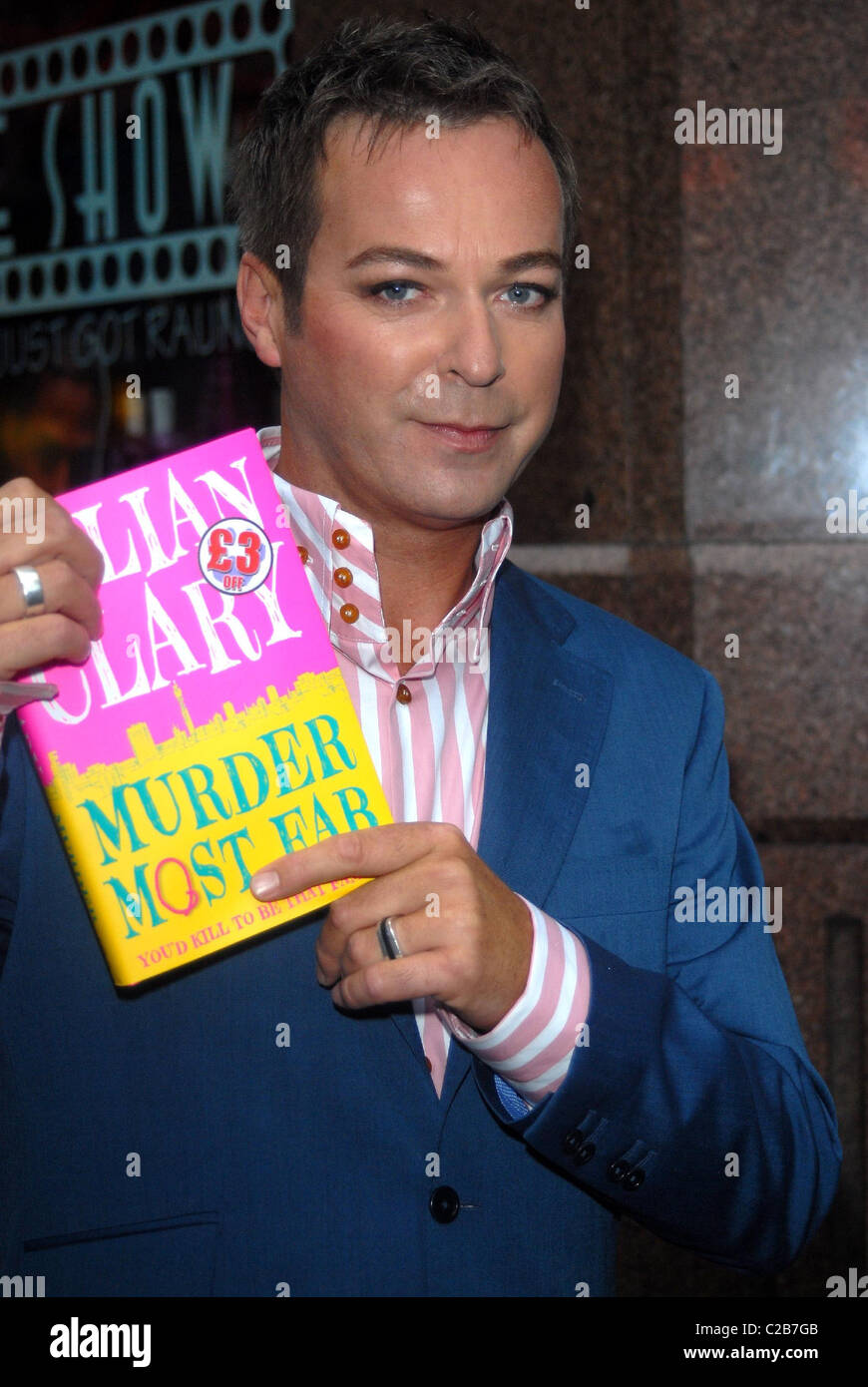 Comedian Julian Clary signs his debut novel 'Murder Most Fab' at