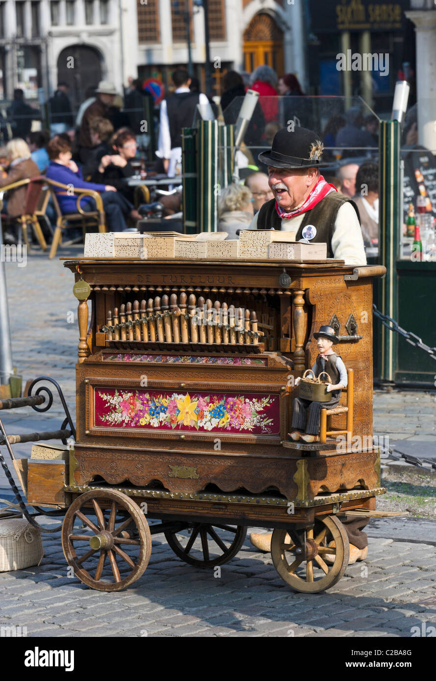 Old barrel organ player in the Grote Markt (Main Square), Antwerp, Belgium Stock Photo