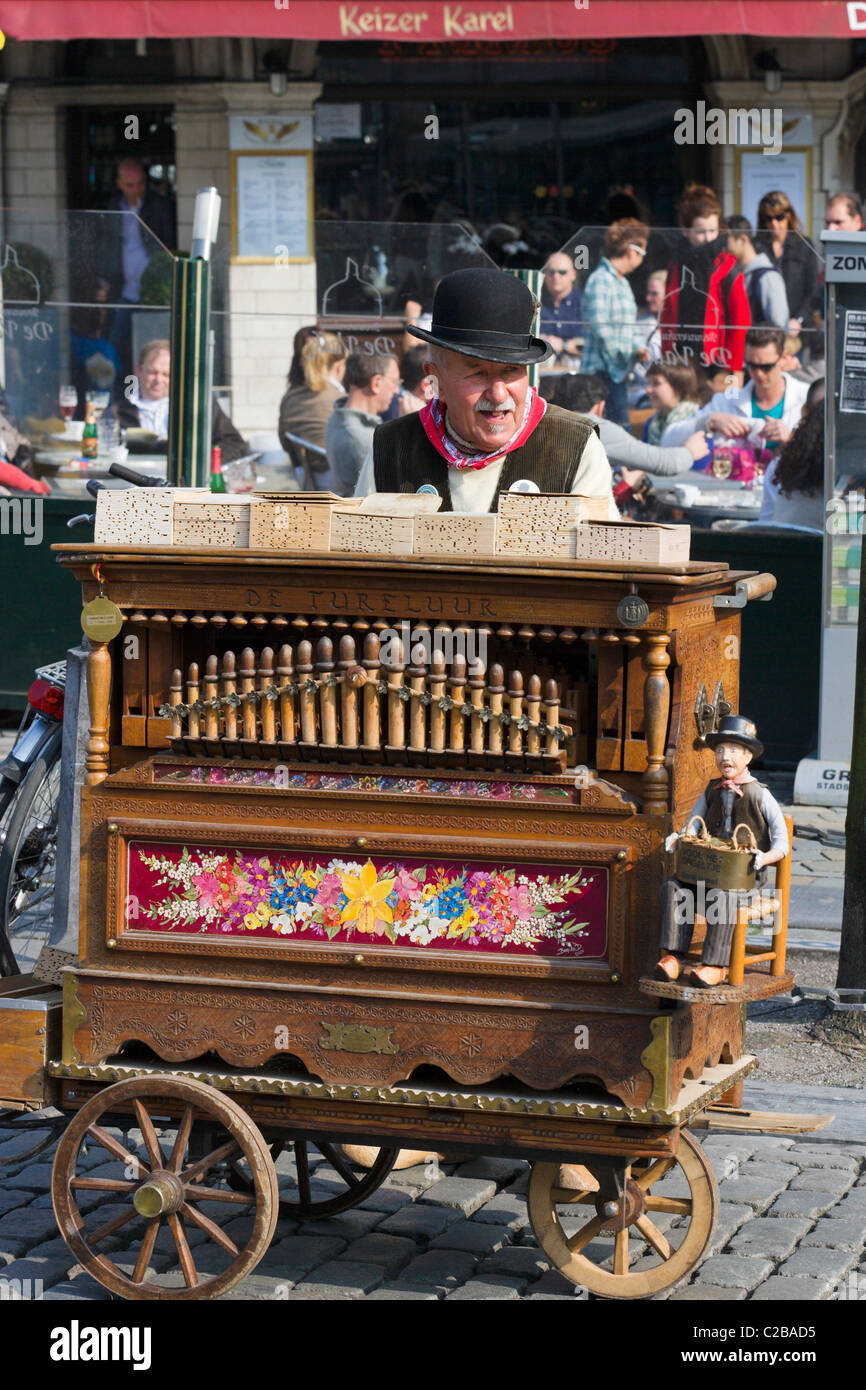 Old barrel organ player in the Grote Markt (Main Square), Antwerp, Belgium Stock Photo