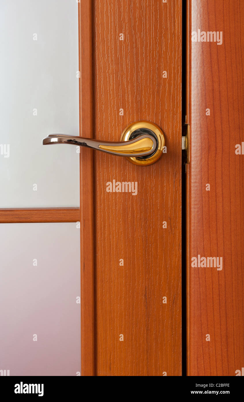 The door handle. A wooden door, brass handles Stock Photo Alamy