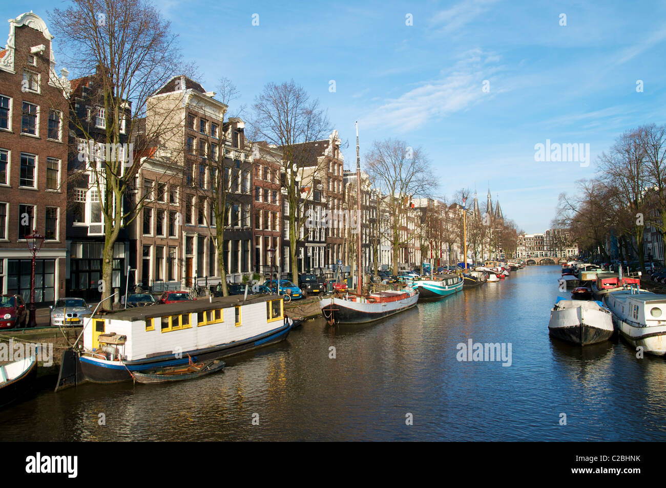 Canal in the Jordaan district in Amsterdam with houseboats in the winter. Stock Photo