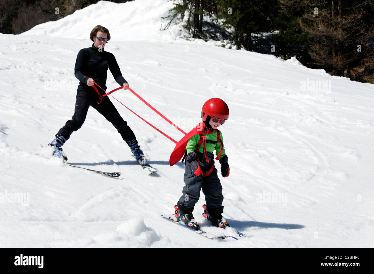 A young boy learning to ski on snow Stock Photo Alamy