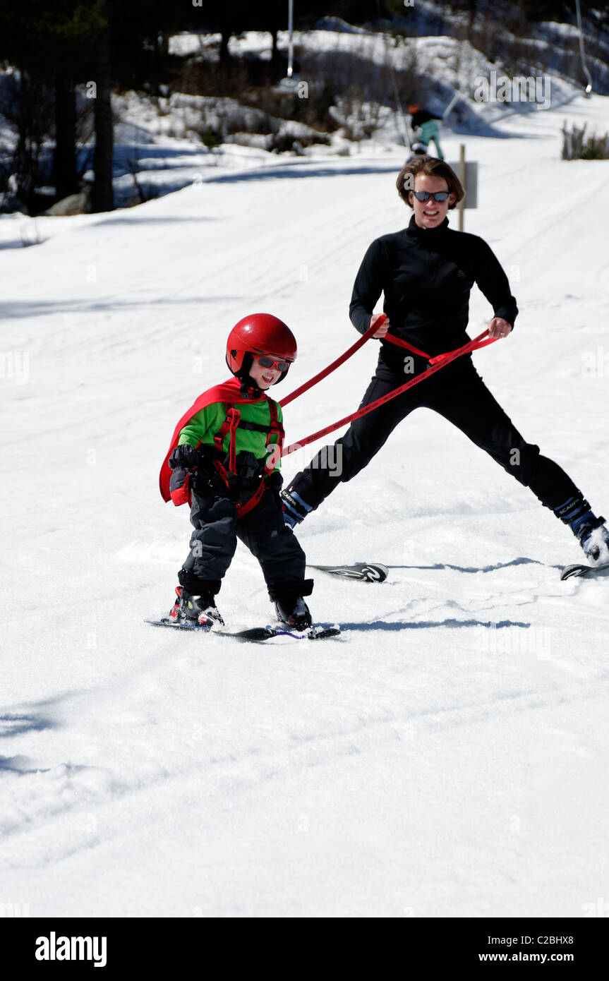 A young boy learning to ski on snow Stock Photo Alamy