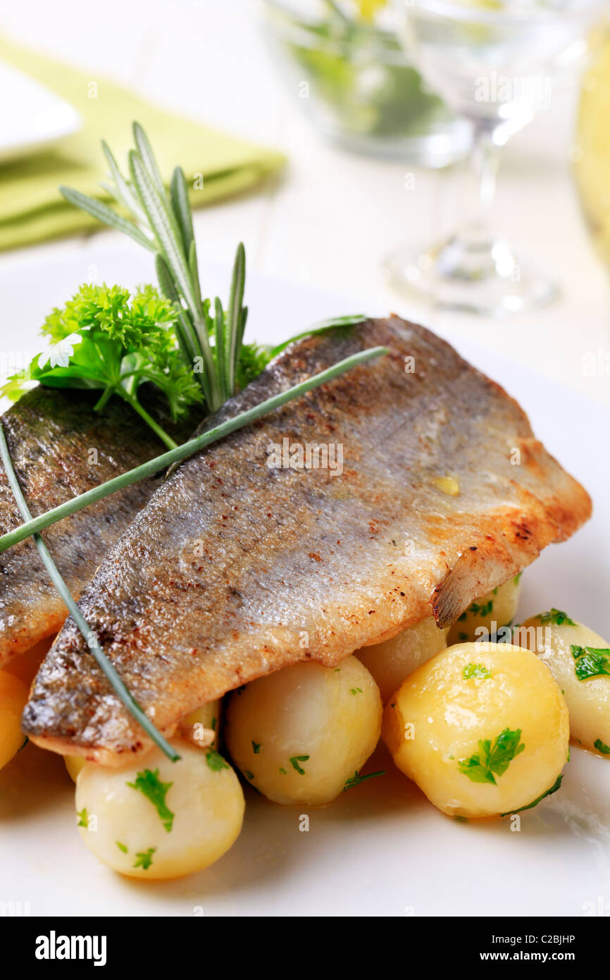 Pan fried trout fillets with potatoes - detail Stock Photo