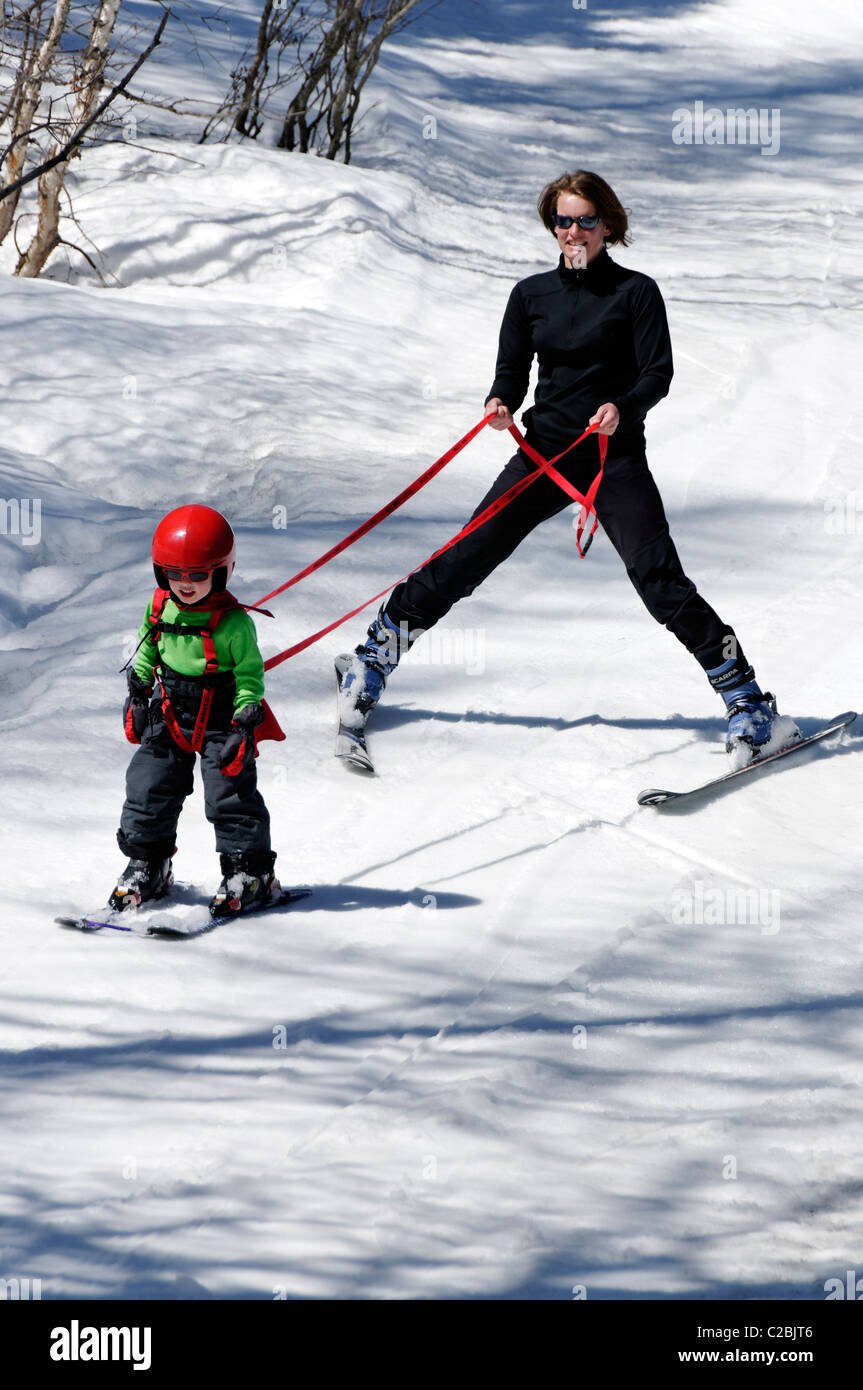 A young boy learning to ski on snow Stock Photo Alamy
