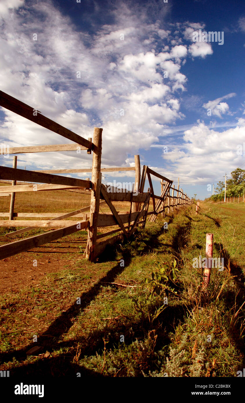 landscape with wooden fence and clouds Stock Photo - Alamy