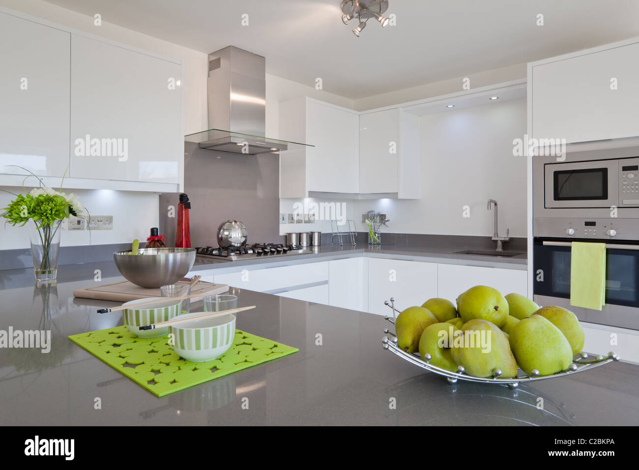 Newly fitted modern kitchen with built in appliances, utensils and