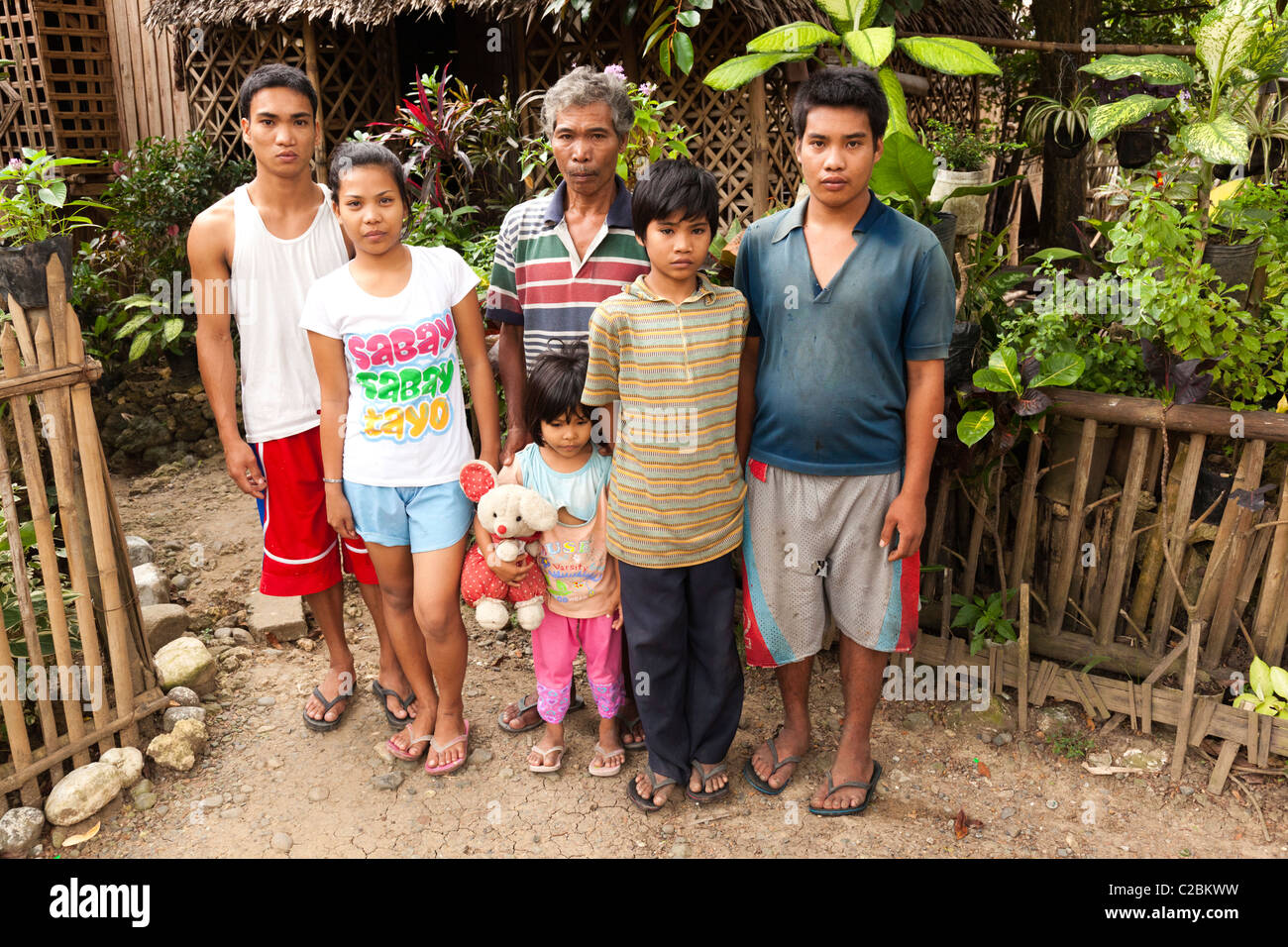 Portrait of a Filipino family outside their house. Iloilo the Philippines Stock Photo