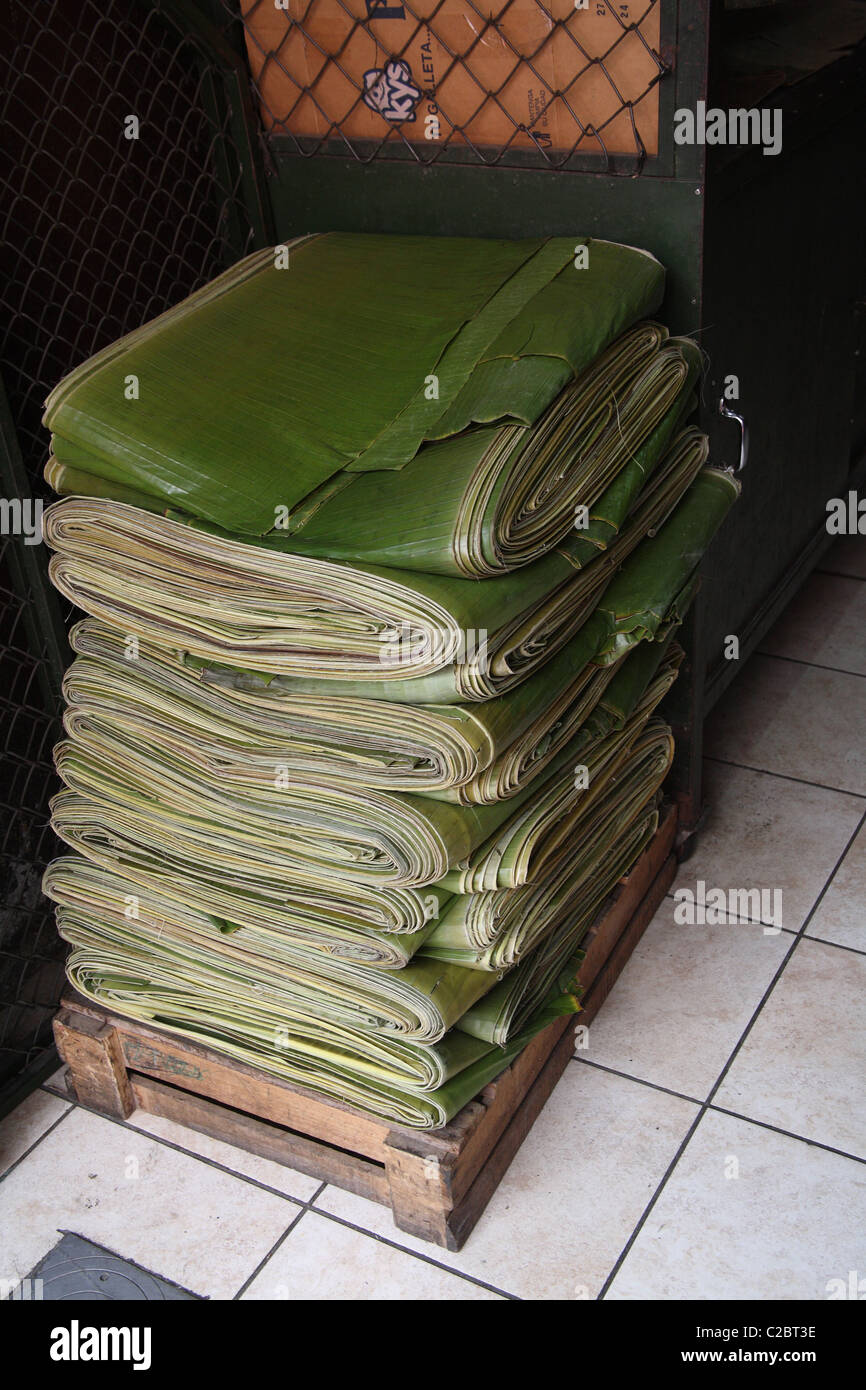 Tall stack of folded banana leaves for sale Stock Photo Alamy