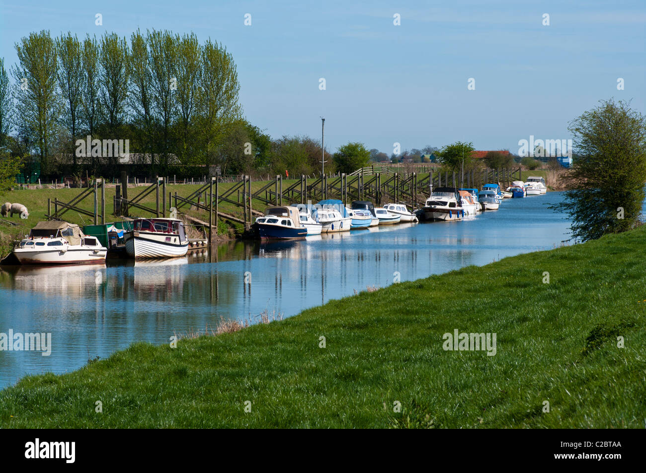 Boats Moored On The River Rother Near Iden East Sussex England Stock