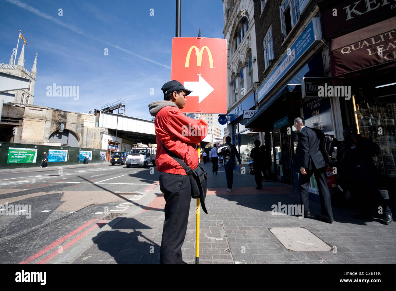 Street advertising for McDonalds restaurants at lunchtime near London Bridge. Stock Photo
