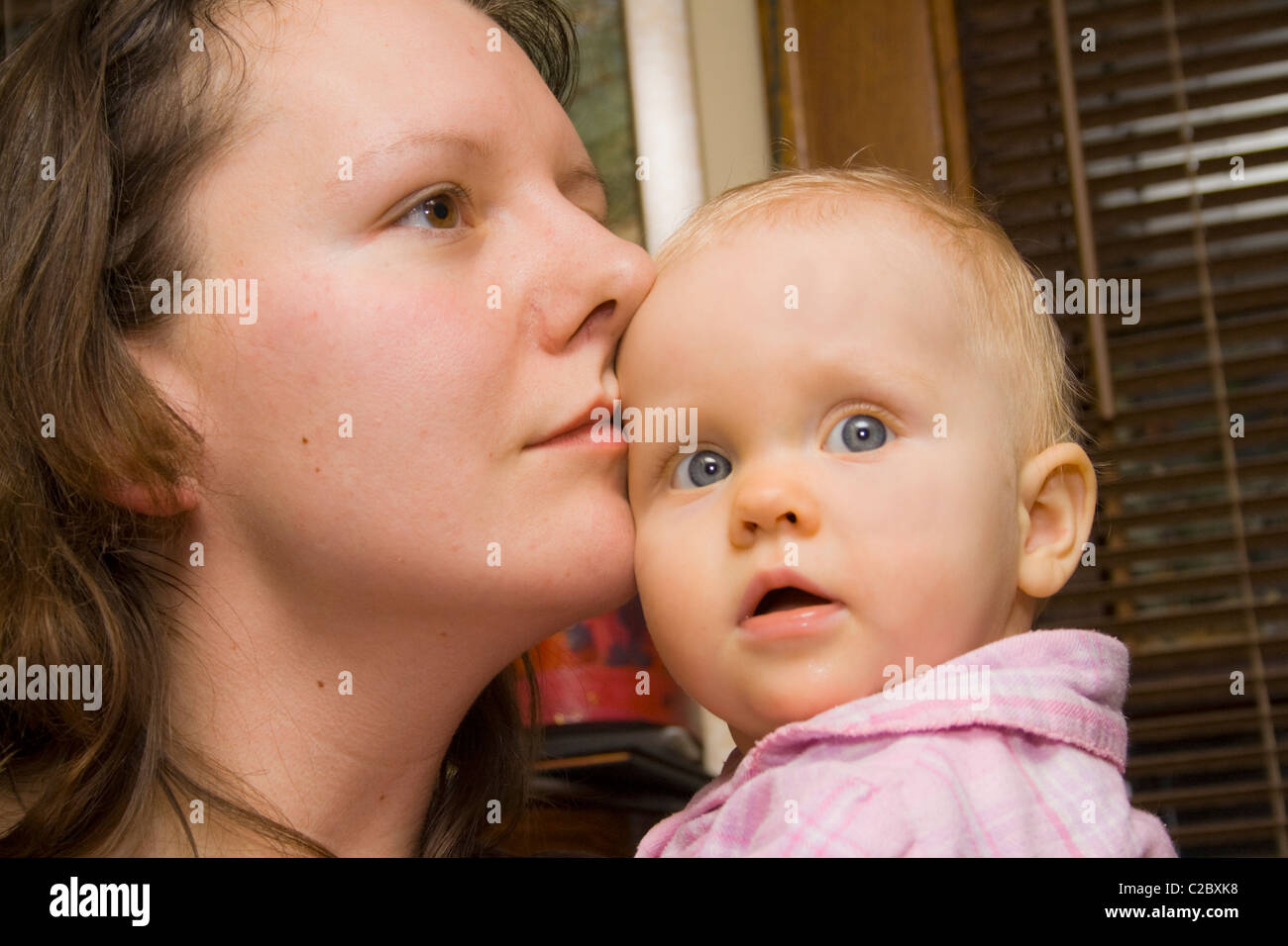 Mother age 29 cherishing her baby daughter. St Paul Minnesota MN USA Stock Photo