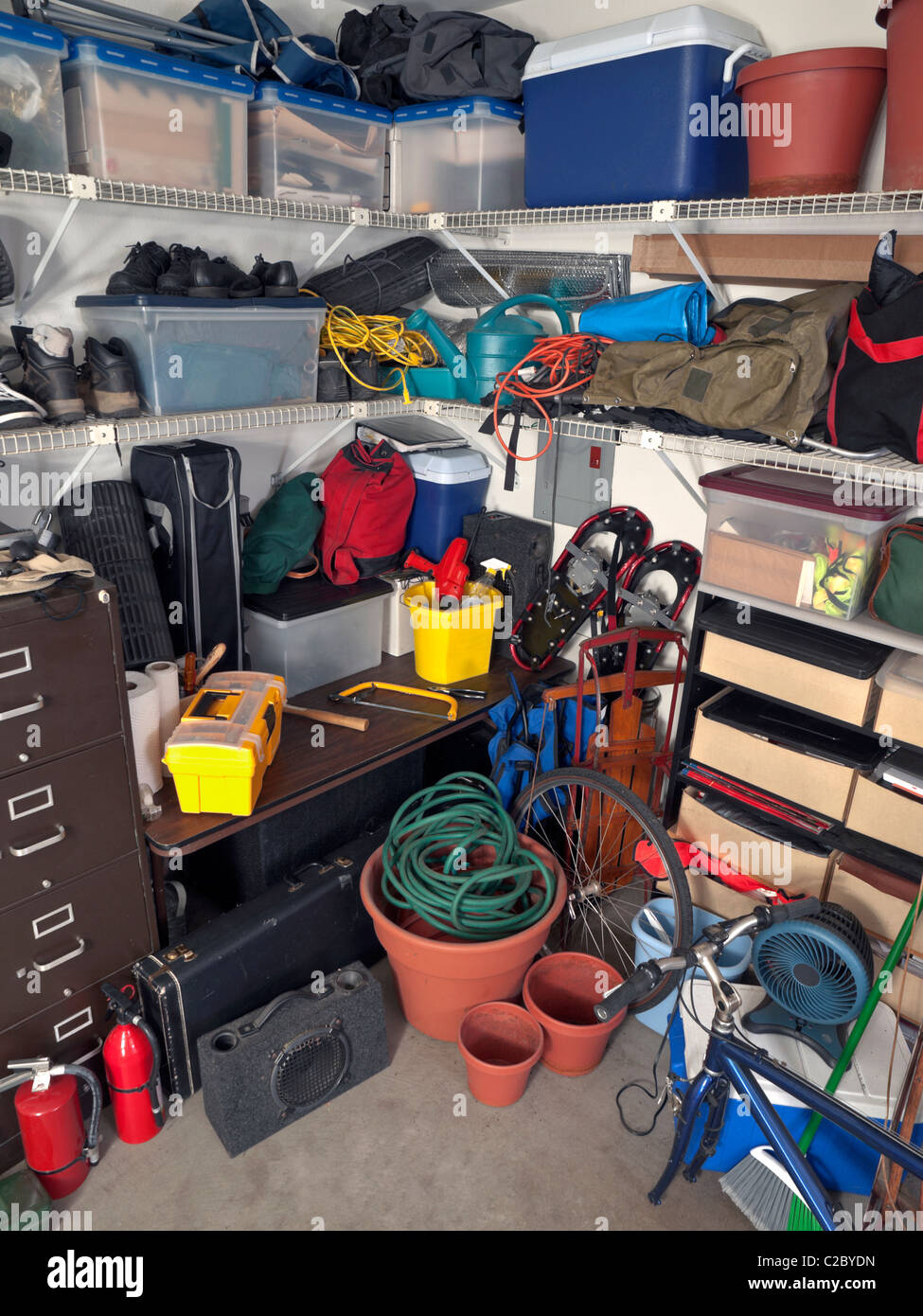 Cluttered corner of a busy residential garage. Stock Photo