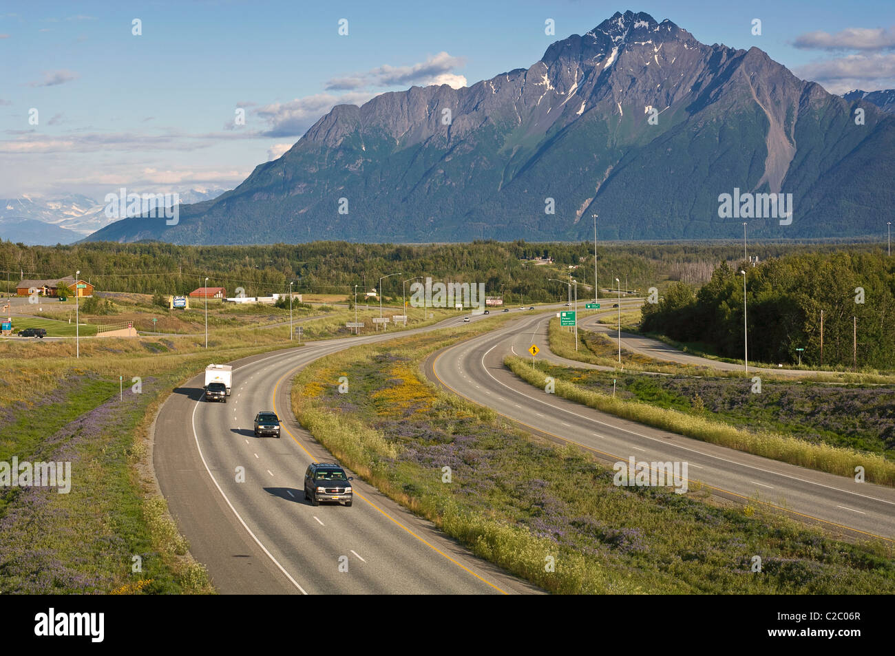 Vehicles travel on the Parks Highway through the Mat-Su Valley. The highway connects the cities of Anchorage and Fairbanks. Stock Photo