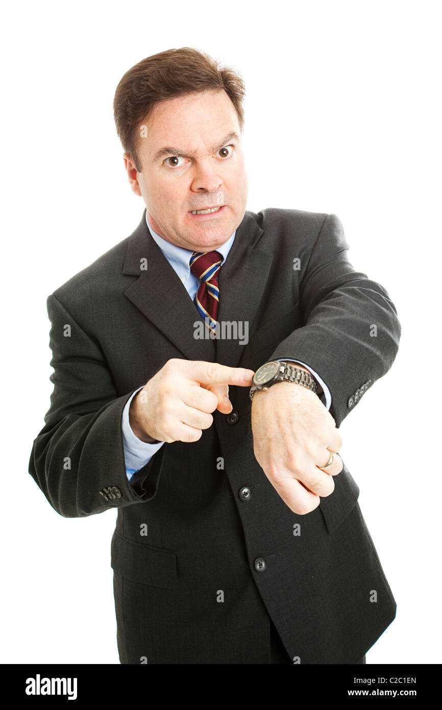 Businessman impatiently pointing to his watch. Isolated on white.  Stock Photo