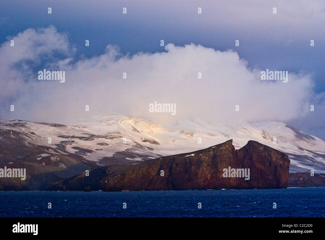 Rugged snow and ice encrusted mountain surrounding a volcanic caldera. Stock Photo