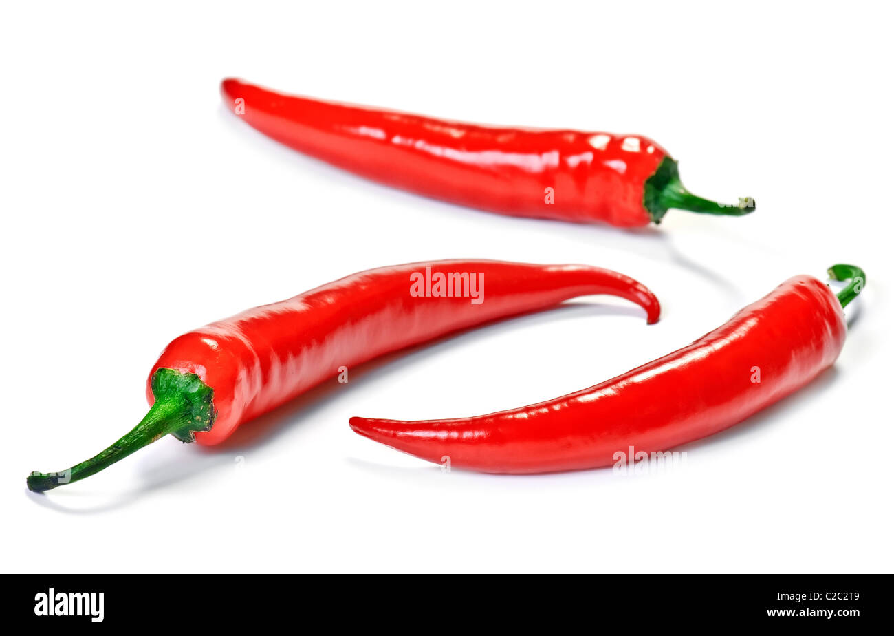 Red chili peppers on a white background Stock Photo - Alamy