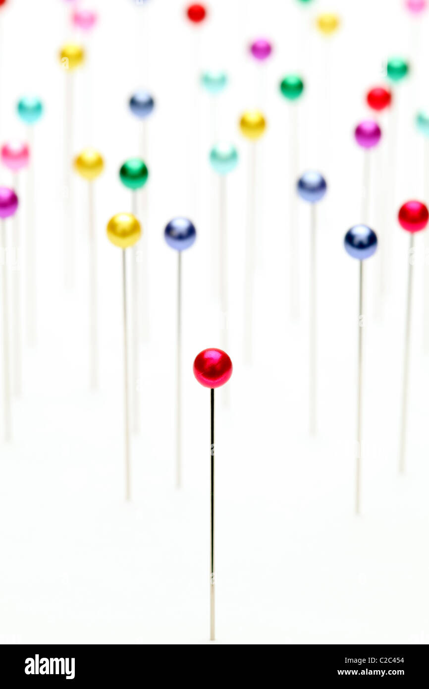 Colorful pins on white background Stock Photo - Alamy image.