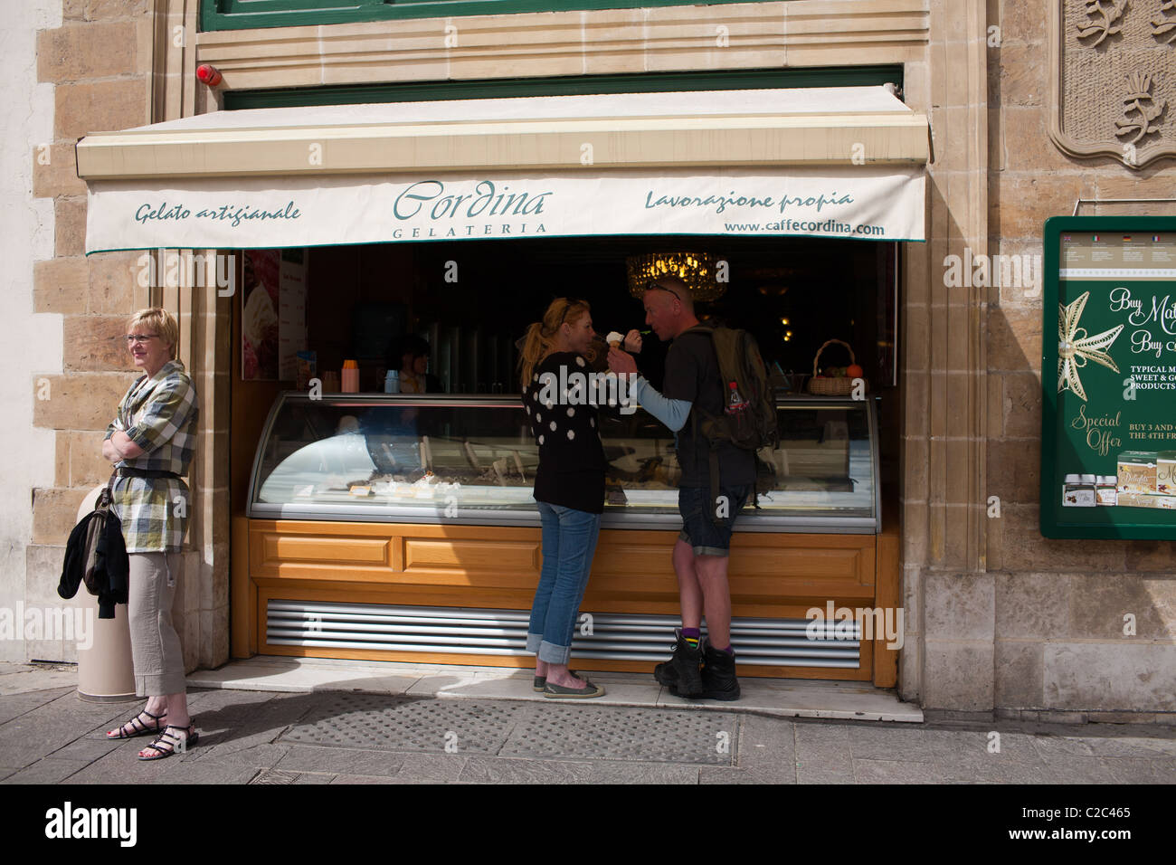A Young Couple enjoying an ice cream at Caffe Cordina in Valletta Stock Photo