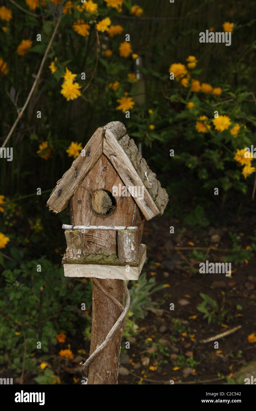 rustic birdhouse in garden Stock Photo