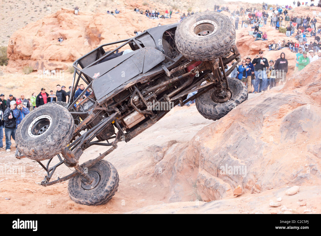 Rollover on the slick sandstone. The area surrounding Moab in Southeastern Utah is a paradise for off-roaders. Grand County, Utah, USA. Stock Photo