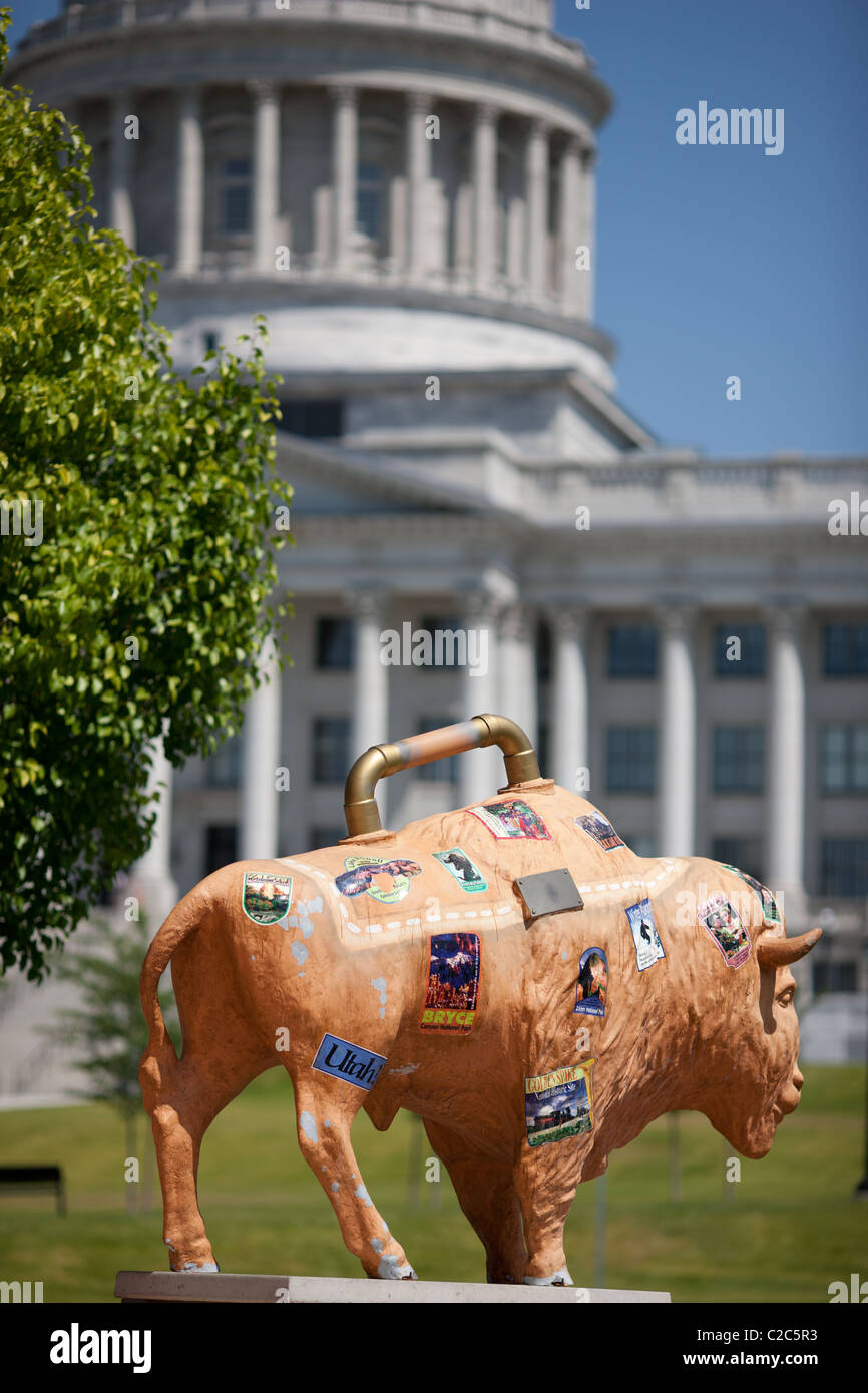 BISON SCULPTURE AT THE COUNCIL HALL WITH THE UTAH STATE CAPITAL IN