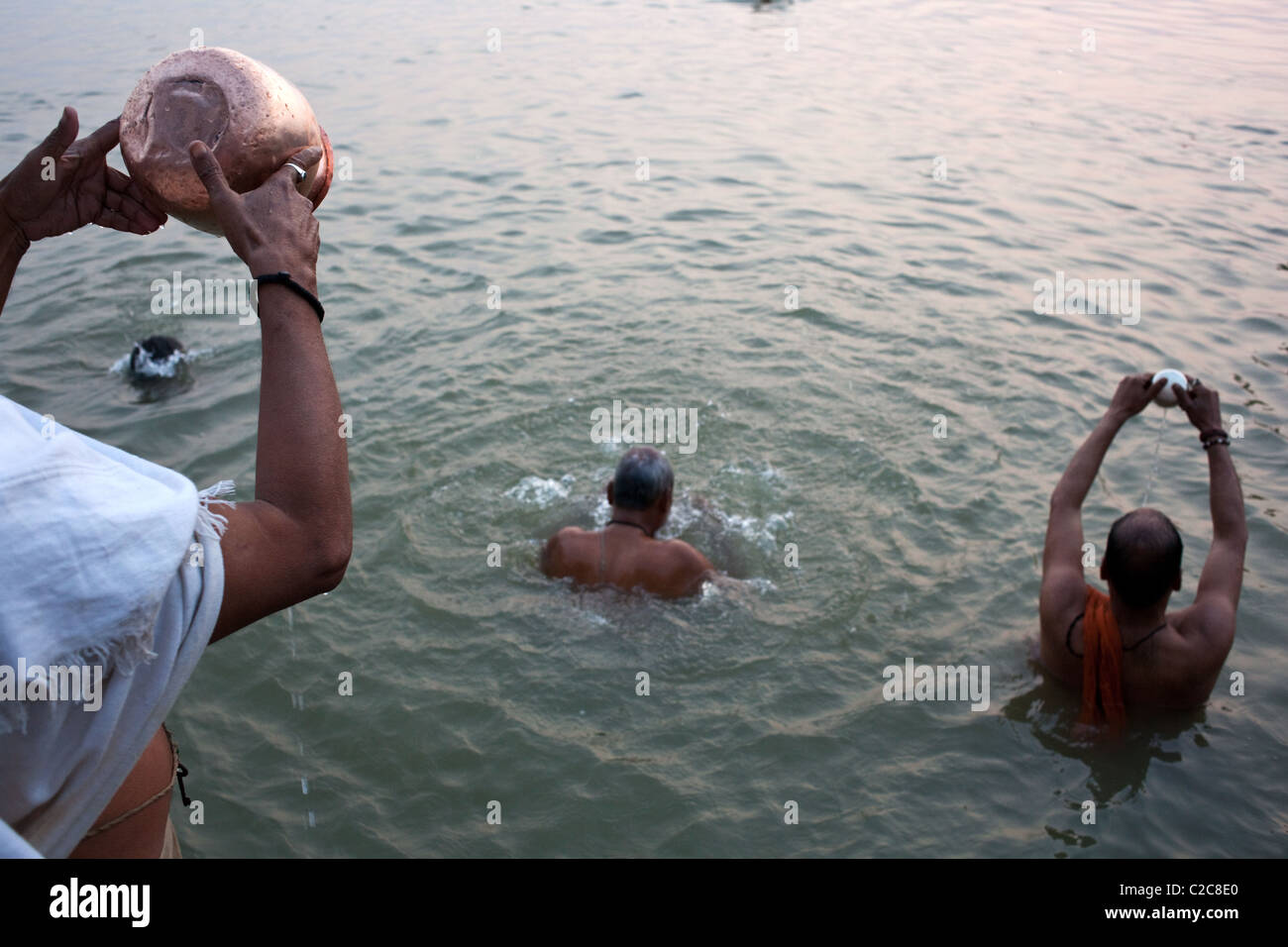 A brahmin prays at sunrise on Ganges river in Varanasi (Benares), Uttar Pradesh state, India. Stock Photo