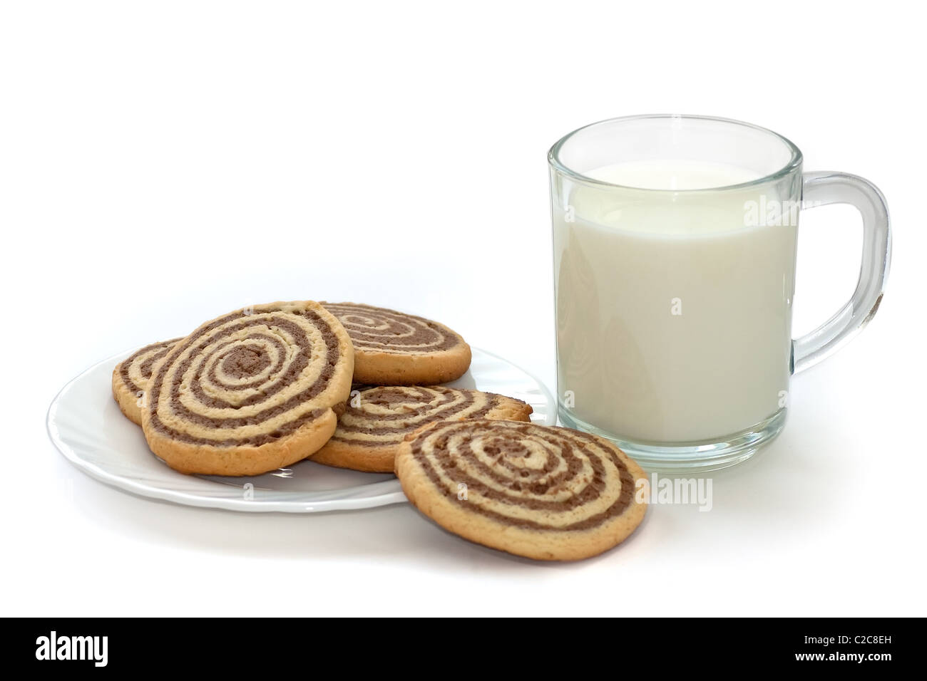 black and white cookies on the plate with cup of milk Stock Photo